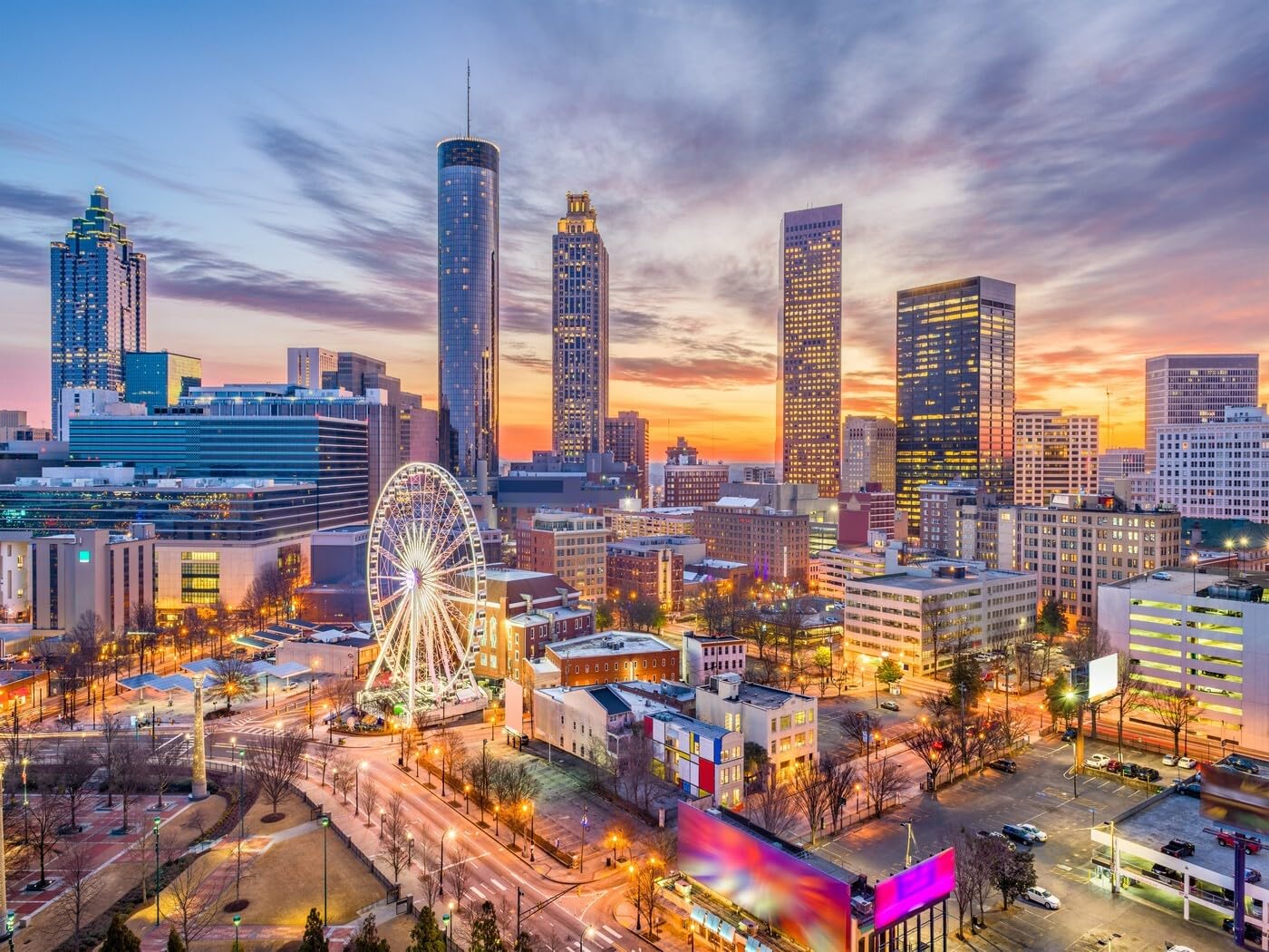 Atlanta skyline at sunset with vibrant orange and purple sky
